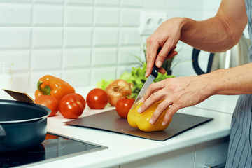 woman cutting vegetables in the kitchen