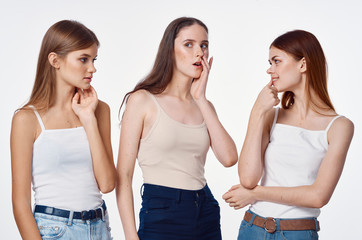 two women whispering gossip