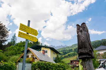 Yellow hiking table showing the way for hiking Austria alps.