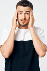 Fototapeta premium portrait of a man with hands on his head