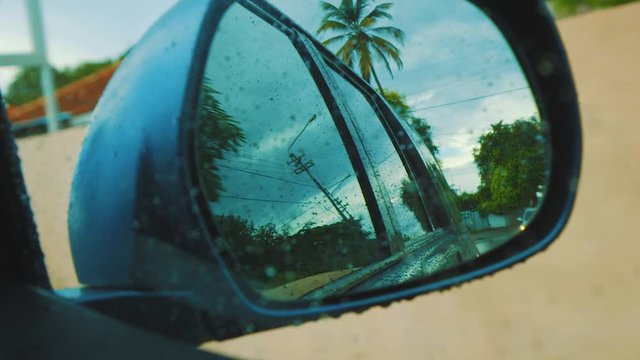 Looking At The Side Mirror Of The Car While Driving Through The Suburban Area Of Curacao - Close Up