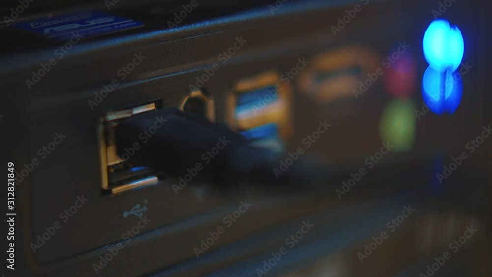 Poster a usb getting plugged in a device for use - close up shot
