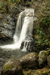 Obraz premium Inversnaid hotel waterfall, loch lomond, highlands, scotland.