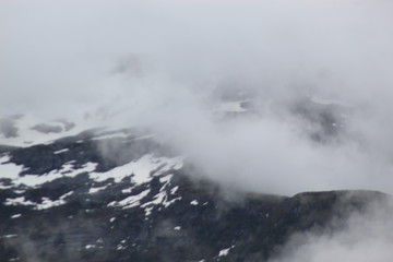 snowy foggy mountains