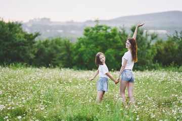 mother and daughter in the field