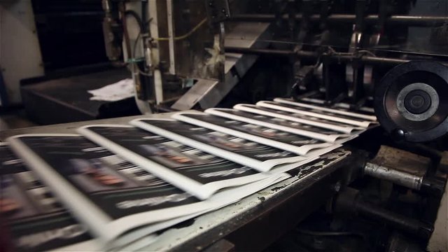 newspaper being printed offset printing press