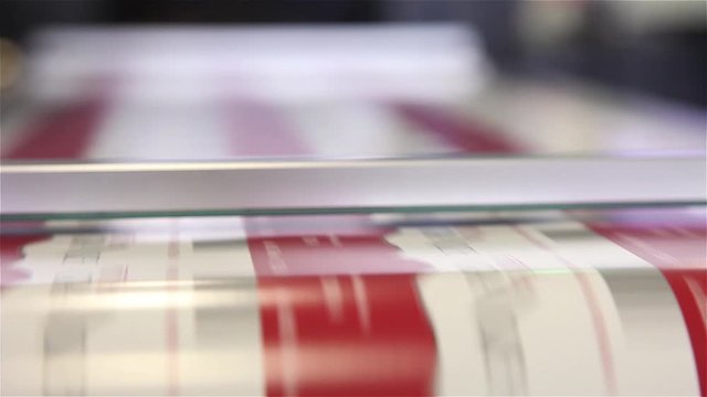 newspaper being printed offset printing press