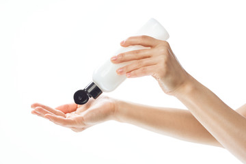 hand with bottle of perfume isolated on white