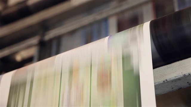 newspaper being printed offset printing press