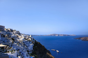 Fototapeta na wymiar View of the white houses of Thira, the capital of Santorini, the sea and the volcanic caldera