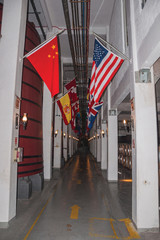 Corridor with tanks for wine storage and flags
