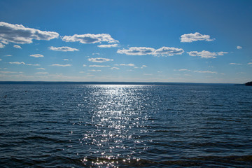 Sunset glinting off gentle waves on Waskesiu Lake in Prince Albert National Park in Saskatchewan...