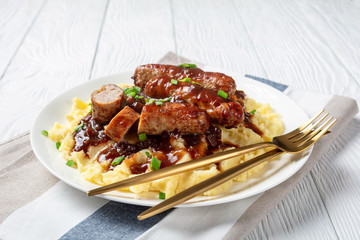 Bangers and Mash with Onion Gravy on a plate
