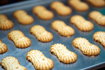 Shortbread.  Production of shortbread cookies at a confectionery factory.  Shortbread cookies on a metal rack after baking in the oven.