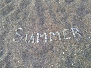 summer inscription in the sand
