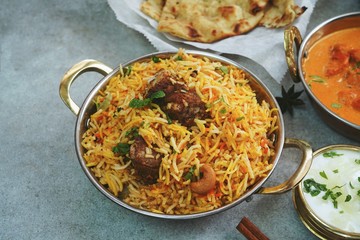 Indian meal menu - Goat Biryani Butter chicken Naan background