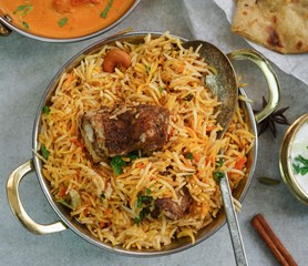 Indian meal menu - Goat Biryani Butter chicken Naan background