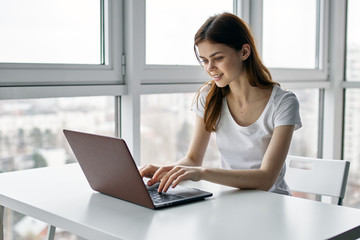 woman working on laptop at home