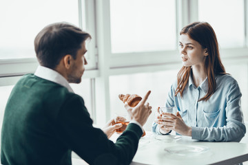 man and woman talking on the phone