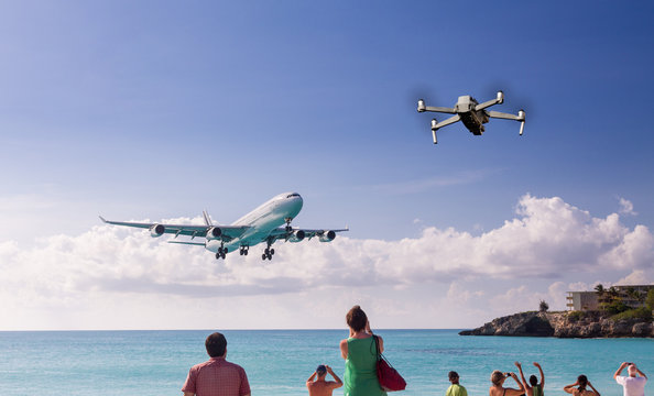 Conceptual composite of modern drone taking photos of International jet plane landing at airport on Caribbean island of St Martin