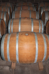 Wooden barrels for wine storage in a cellar