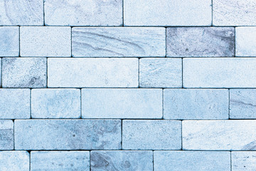 Blue stone wall made of natural marble, decorated in antiquity