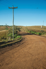 Deserted dirt road passing through rural lowlands