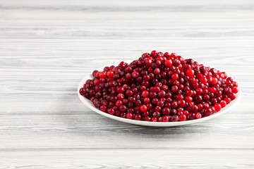 Cranberries on a wooden table.