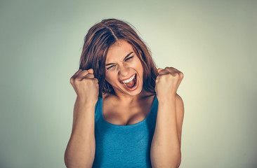 Victorious girl holding fists up