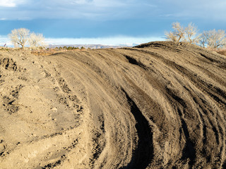 Dirt tracks in a sandy motocross track
