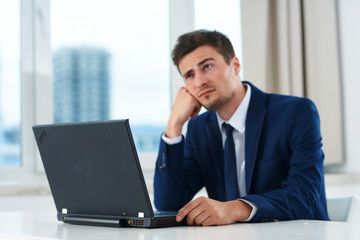 businessman working on laptop in an office