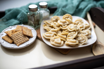 Russian pelmeni or meat dumplings, traditional family dish