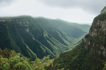 Fototapeta na wymiar Fortaleza Canyon with rocky cliffs on foggy day