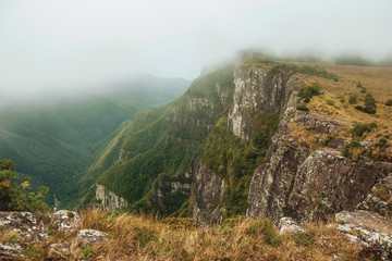 Fortaleza Canyon with rocky cliffs on foggy day