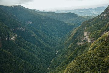 Fortaleza Canyon with rocky cliffs on foggy day