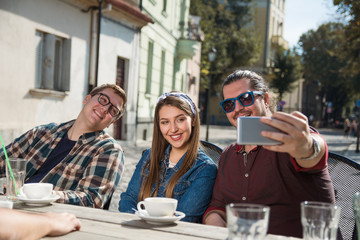 Group of friends making selfie