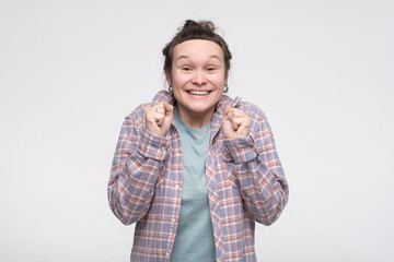 Excited overjoyed caucasian young woman is excited with news or gift. Is it all for me concept.