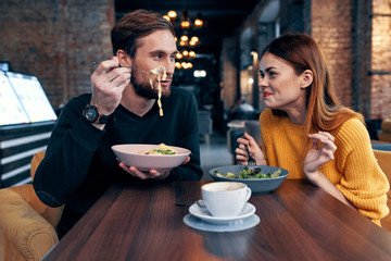 young couple having dinner in restaurant