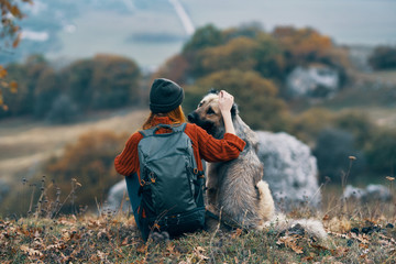 Woman in nature with a dog