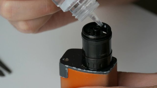 Vape brown tobacco juice tank refill. Vaping eCigarette Tools. Brown electronic cigarette tank refill