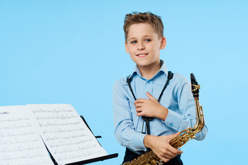 portrait of boy with guitar on white background
