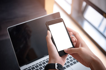 woman hand holding smartphone with blank screen for design or Advertisement.