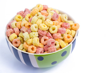 Cereal flakes in bowl on white background