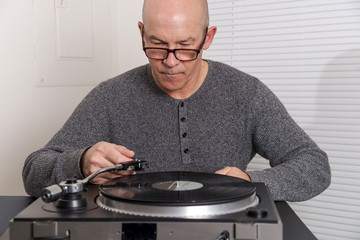 man  listens to records