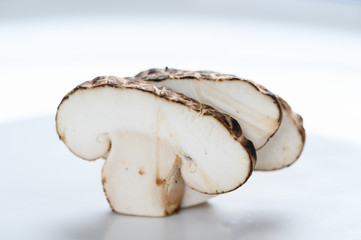 Shiitake mushrooms on the wooden background.
