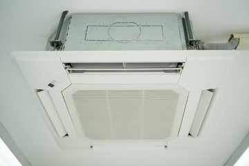 Modern ceiling air conditioner in office close up.