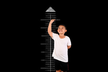 The boy measured the height with the blackboard