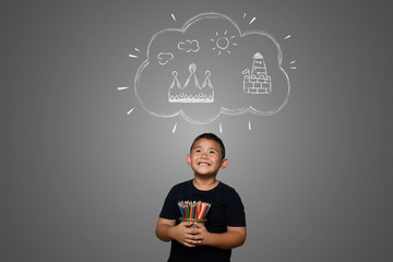 A boy with a pencil drawing a dream background