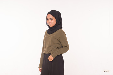 Casual Hijab Fashion.Cute Muslim girl with casual dress and hijab isolated over white background.