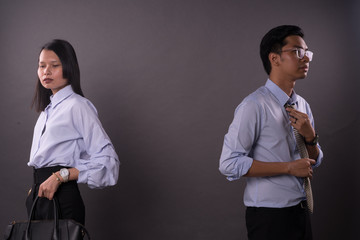Asian business man and woman.Asian female and male model wearing office attire.
